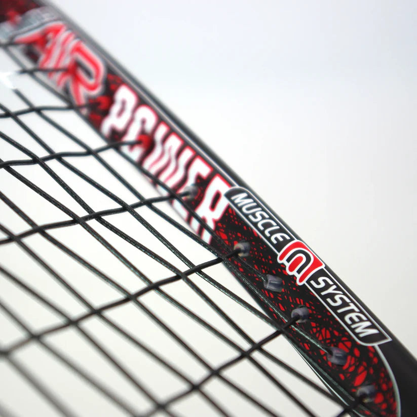 Close-up of the Karakal Air Power 2.1 Squash Racket by Karakal, showcasing its black and red high modulus graphite frame with "AIR POWER" and "MUSCLE SYSTEM" text, plus visible black strings.