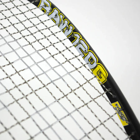 Close-up of the Karakal Raw 120 2.1 Squash Racket by Karakal, an ultra-light graphite racket, showing details of the strings and frame with “RAW 120G” marking visible.