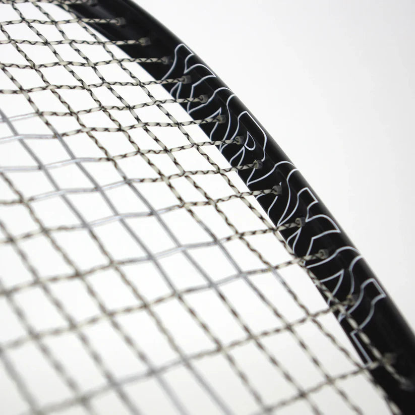 A close-up of the Karakal Raw 120 2.1 Squash Racket, featuring woven strings and a partially visible Karakal logo on the frame, set against a plain background.