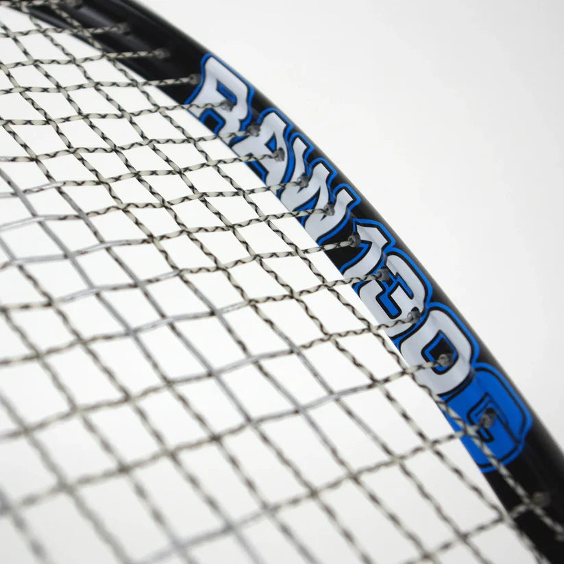 Close-up of a Karakal Raw 130 2.1 Squash Racket featuring a graphite frame, tightly woven strings, and bold white and blue "RAW 130G" lettering on the frame, set against a plain white background.