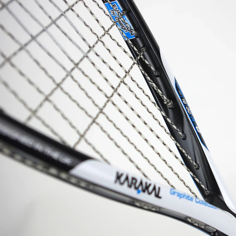 Close-up of the Karakal Raw 130 2.1 Squash Racket, featuring black, white, and blue detailing on its graphite frame and strings, with part of the head shown against a plain white background. Brand: Karakal.