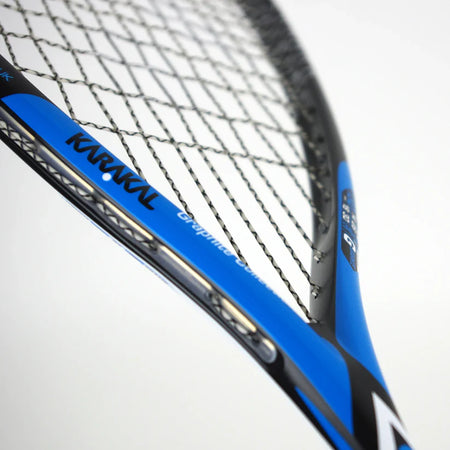 Close-up of the Karakal Raw 130 2.1 Squash Racket by Karakal, featuring its graphite frame, strings, and detailing in blue and black against a plain white background.