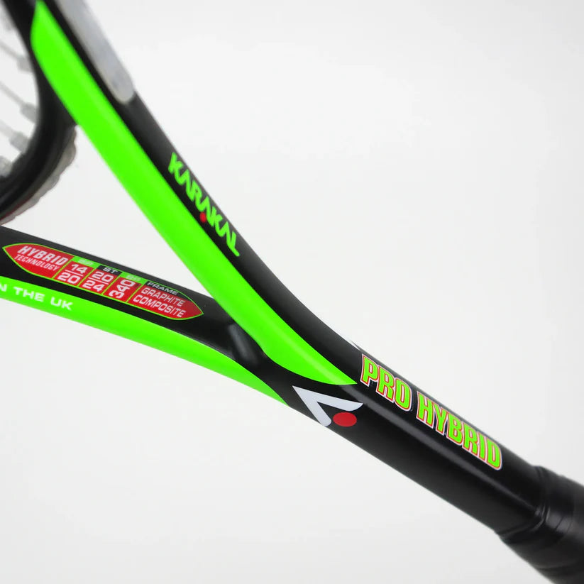 Close-up of the Karakal Pro Hybrid 2.1 Squash Racket in black and neon green, featuring the Karakal brand name, specifications, and PRO HYBRID text on the shaft against a plain white background.