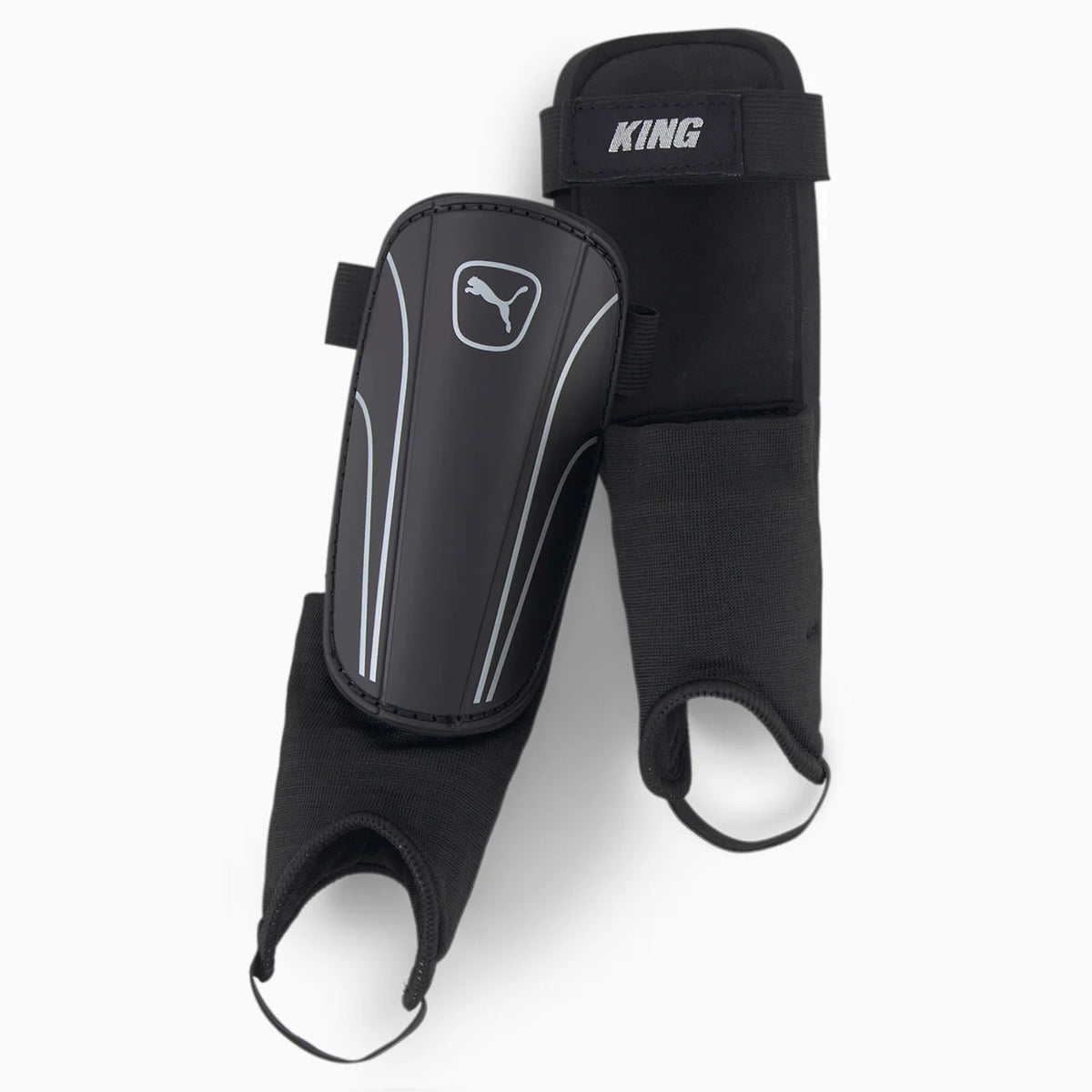 Puma King Shin & Ankle Guards by Puma offer black football protection with shock-absorbing ankle support, elastic straps for a secure fit, and feature the Puma logo on each guard.