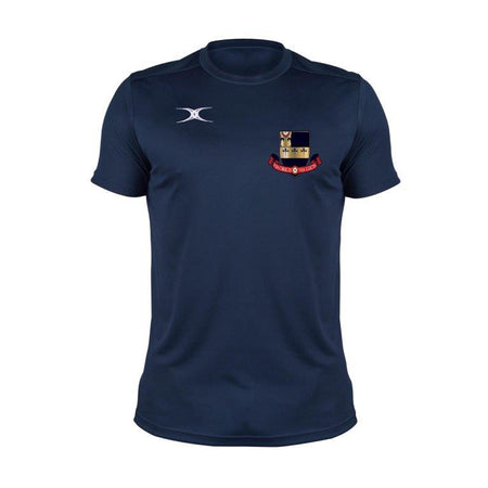 The Gilbert Kings School Photon II Tee Shirt in navy blue features moisture control, a small white logo on the right chest, and a crest with red text and a castle on the left, displayed against a plain white background.