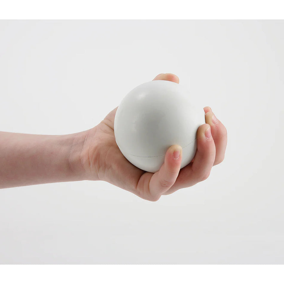 A hand holds the Mastersport Pop Lacrosse Ball, a lightweight 7cm vinyl ball, against a white background.