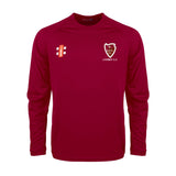 The Lydney CC Matrix V2 Long Sleeve Maroon T-Shirt by Gray Nicolls features LYDNEY C.C and a white/red crest on the left chest, two small white/red logos on the right, moisture-wicking fabric, and no collar.