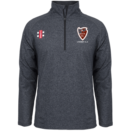 The Gray Nicolls Lydney CC Velocity Mid Layer is a dark gray, long-sleeve, stretch-fit quarter-zip top with a stand-up collar and features embroidered cricket and "LYDNEY C.C." shield logos on the chest.