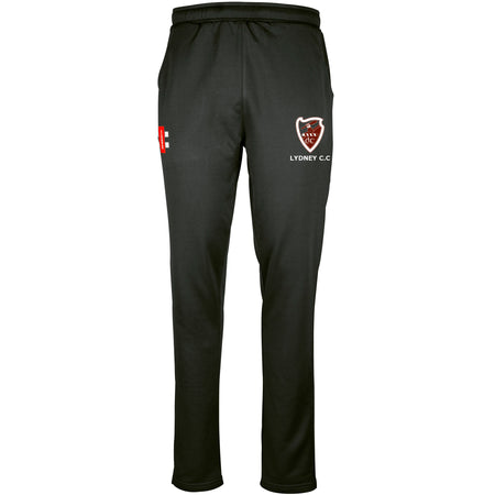 The Gray Nicolls Lydney CC Pro Performance Training Trousers feature an elastic waistband, tailored fit, LYDNEY C.C. and red/white shield logo on the right thigh, plus a small left logo—designed for comfort and moisture management.