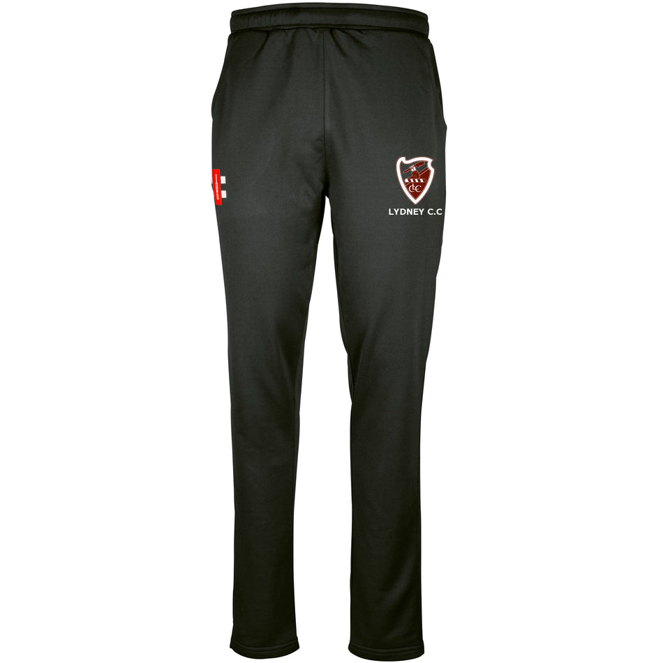 The Gray Nicolls Lydney CC Pro Performance Training Trousers feature an elastic waistband, tailored fit, LYDNEY C.C. and red/white shield logo on the right thigh, plus a small left logo—designed for comfort and moisture management.