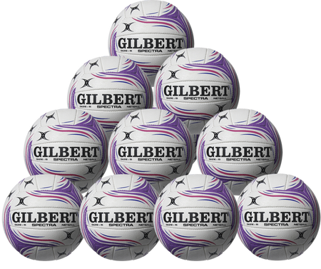 Ten white Gilbert Spectra netballs with purple and grey swirl designs are stacked in a pyramid. The Gilbert brand is clearly visible on each ball in this ten-pack club set.