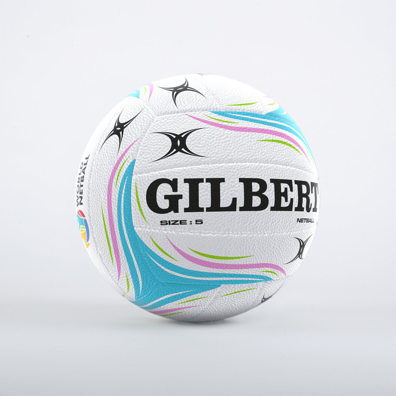The Gilbert Aurora Match Netball by Gilbert is a size 5 white ball with blue, green, and pink curves, black star patterns, and fused rubber construction, displayed on a plain light background.