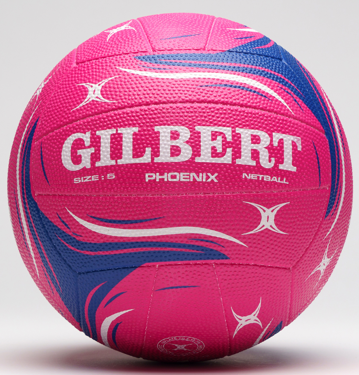 The Gilbert Phoenix Match Netball by Gilbert is shown in pink, featuring a textured surface and white star-shaped designs, size 5, set against a light plain background.