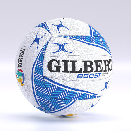 The Gilbert Boost Match Netball, size 5, features a white and blue design with zigzag patterns, bold GILBERT branding, and the World Netball logo—quality similar to a match ball—shown against a light gradient background.