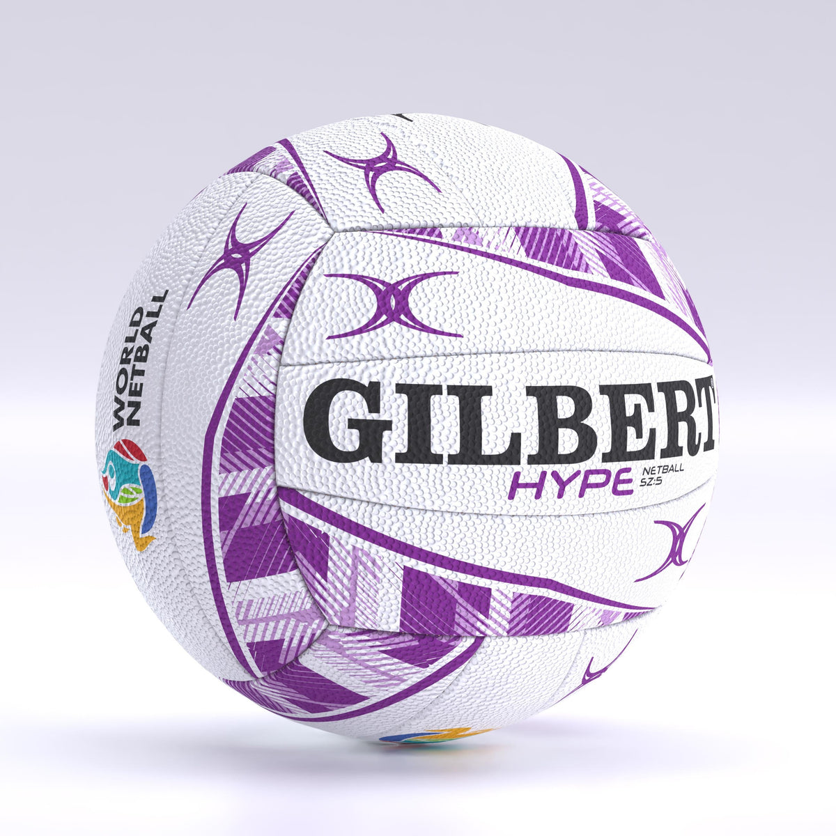 The Gilbert Hype Match Netball by Gilbert is white with purple geometric patterns, "HYPE" text, and the World Netball logo with a colorful globe. It features a performance butyl bladder and is shown on a light gradient background.