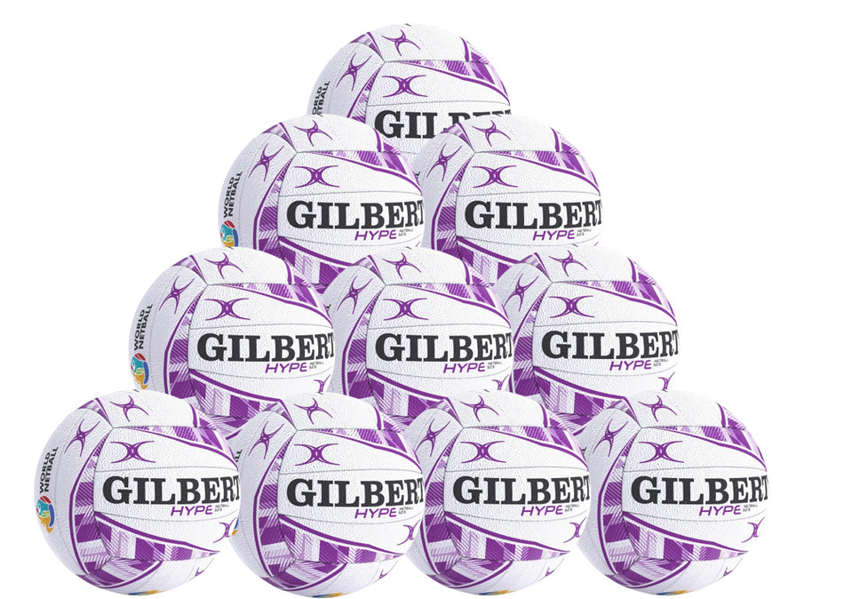 The Gilbert Hype Match Netball Ten Pack by Gilbert features ten white and purple netballs arranged in a pyramid, ideal for match and training sessions. The quality rubber balls are stacked four on the base, then three, two, and one on top.