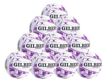 The Gilbert Hype Match Netball Ten Pack by Gilbert features ten white and purple netballs arranged in a pyramid, ideal for match and training sessions. The quality rubber balls are stacked four on the base, then three, two, and one on top.
