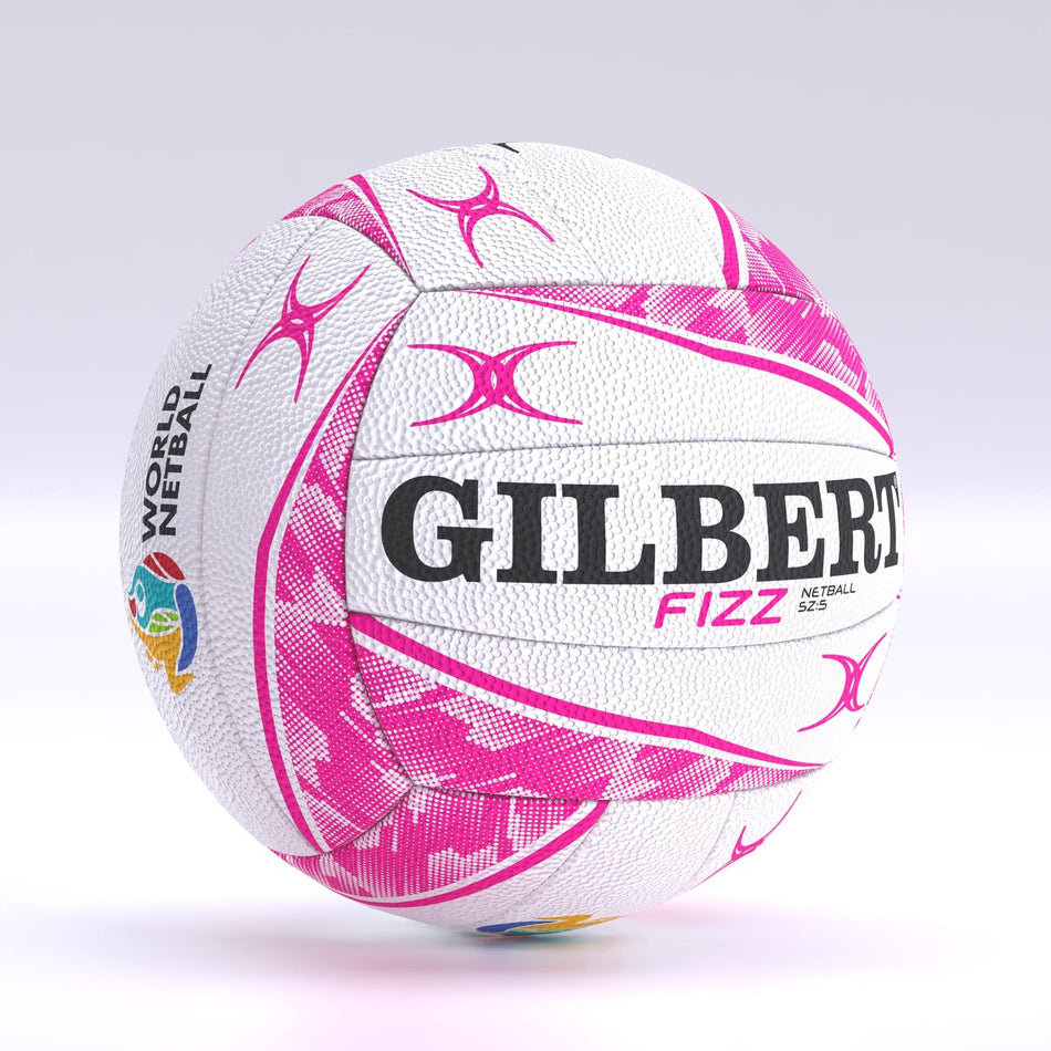 The Gilbert Fizz Match Netball by Gilbert is shown on a light background, featuring white and pink colors, the World Netball logo, FIZZ branding, pink star patterns, and a performance butyl bladder.