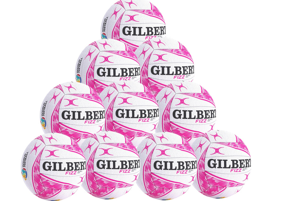 A pyramid stack of ten Gilbert Fizz Match Netballs by Gilbert, white with pink patterns and black branding, featuring performance butyl bladders, arranged in four rows against a plain background.