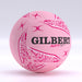 The Gilbert APT 2026 Netball Ten Ball Pack features pink netballs with white and dark pink patterns, a textured surface, and bold black GILBERT branding—perfect for training or outdoor play—displayed on a neutral light background.