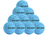The Gilbert APT 2026 Netball Ten Ball Pack includes ten light blue training netballs with black and dark blue patterns, each boldly displaying the Gilbert brand name—ideal for outdoor practice.