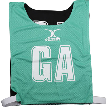A green/black Gilbert Reversible Netball Bib featuring large GA letters and the Gilbert brand—ideal for team bibs at your next game.