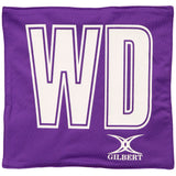 The Gilbert Pro Patch Bibs by Gilbert feature a purple design with large white "WD" letters and a white logo at the bottom right—perfect for identifying team players during netball training sessions.