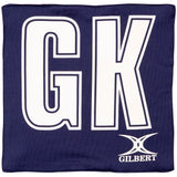 The Gilbert Pro Patch Bibs by Gilbert are navy blue with large white GK letters centered for team player identification in matches or training. The GILBERT logo appears at the bottom right.