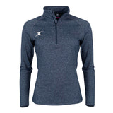 The Gilbert Atom Midlayer by Gilbert is a dark navy, long-sleeve quarter-zip athletic top with a white embroidered left chest logo, standing collar, and fitted, lightweight design, shown on a plain white background.