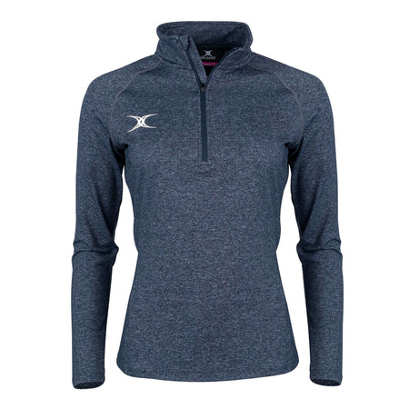 The Gilbert Atom Midlayer by Gilbert is a dark navy, long-sleeve quarter-zip athletic top with a white embroidered left chest logo, standing collar, and fitted, lightweight design, shown on a plain white background.