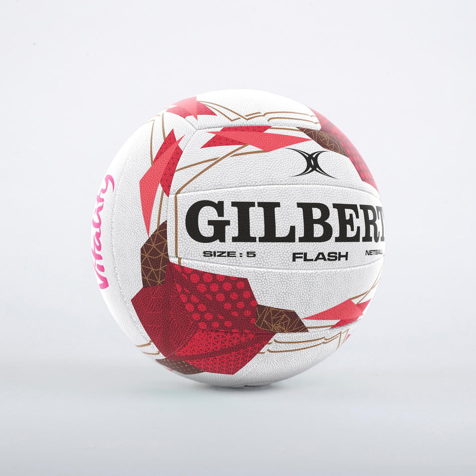 The Gilbert Flash England Netball SZ5 is a white match ball with signature Gilbert grip, red and brown geometric designs, and "VITALITY" detailing—ideal for any England Vitality Netball fan. Displayed on a light grey background.