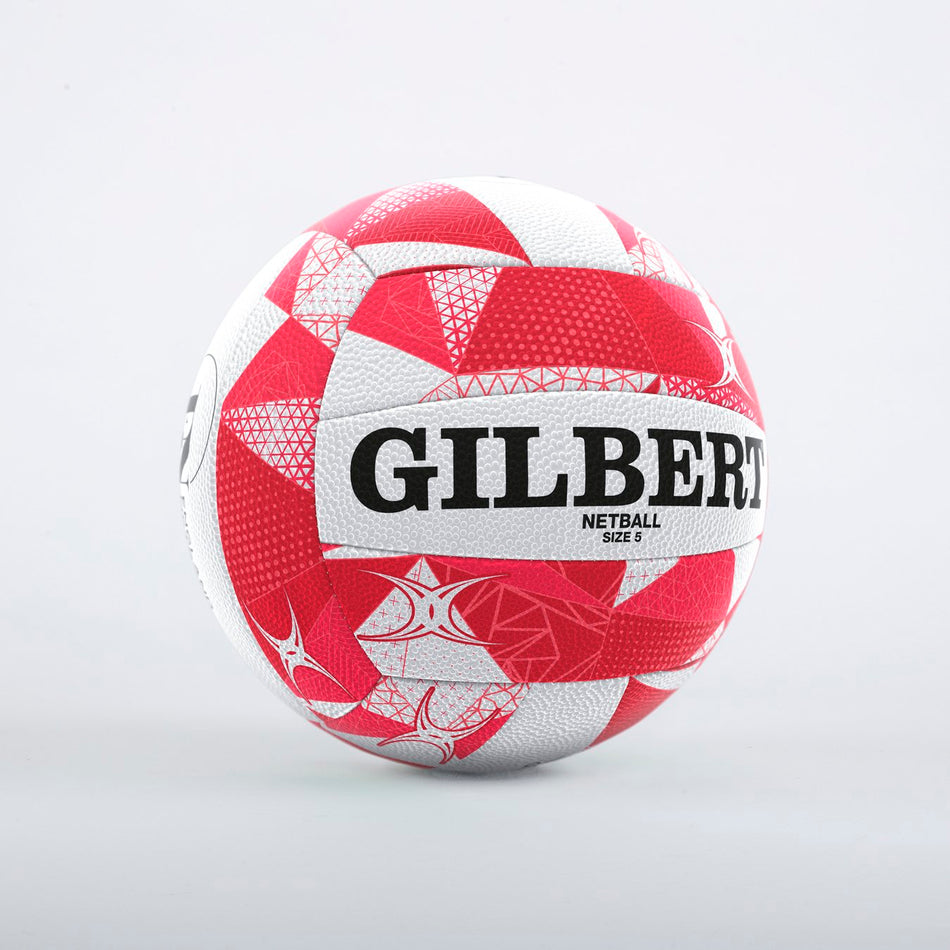 A Gilbert England Supporters Netball SZ5 by Gilbert, featuring a red and white pattern with bold black lettering, is displayed on a plain light gray background.