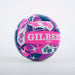 The Gilbert Scotland Supporter Netball is a vibrant Size 5 ball featuring bold pink, purple, and navy geometric and floral designs, with "GILBERT" displayed prominently in large white letters.