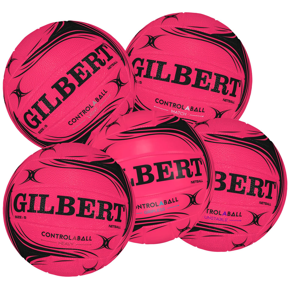 Five vibrant pink Gilbert Control-A-Ball Netballs with black patterns and bold Gilbert branding are arranged together, displaying multiple angles. Ideal for passing and catching drills, these striking training balls stand out on the court.