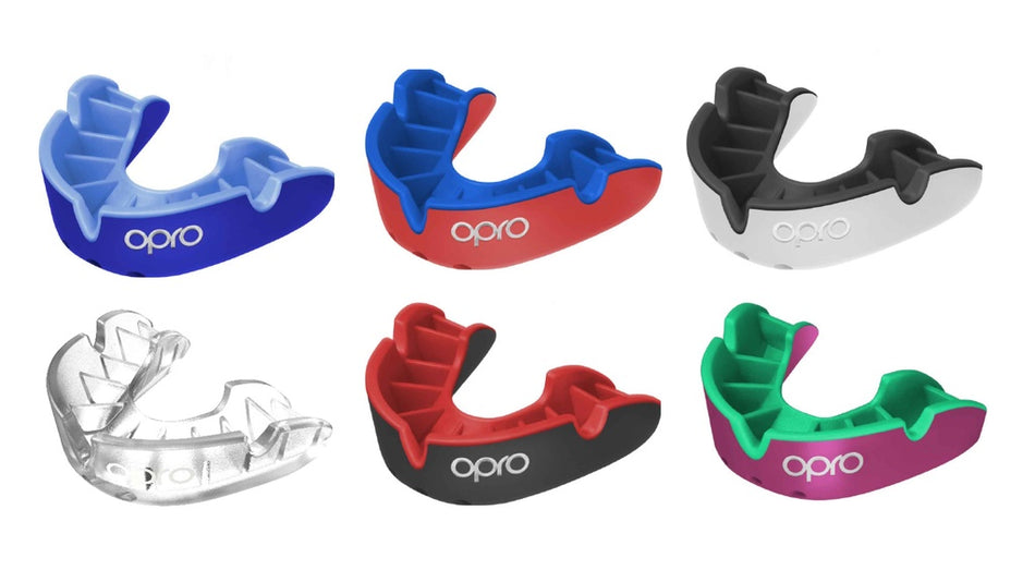 A dark blue/blue OPRO Silver Self-Fit Mouthguard by Opro is shown on a white background. Perfect as a gum shield for combat sports, it features the Opro brand name.