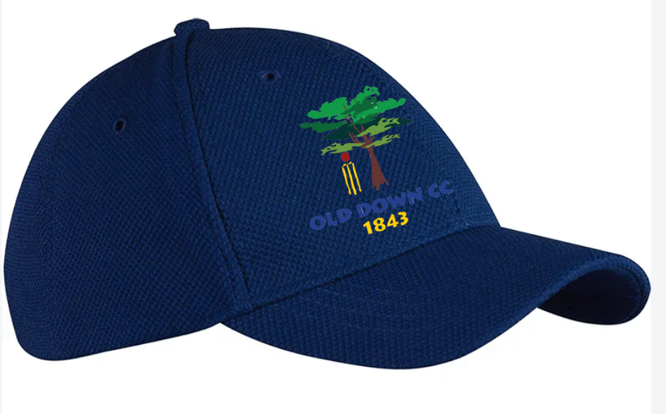 The Gray Nicolls Old Down CC Cricket Cap is a dark blue, adjustable cap featuring an embroidered green tree, cricket stumps, and “OLD DOWN CC 1843” in blue and yellow on the front.