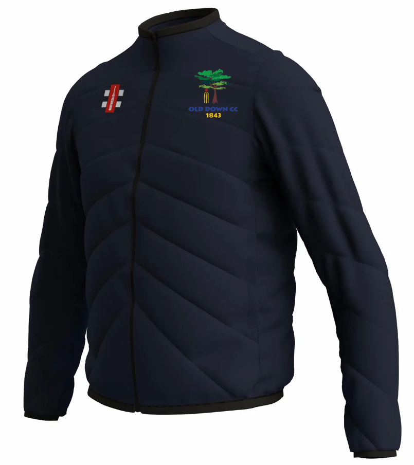 The Gray Nicolls Old Down CC GTS Full Zip Jacket is a navy padded jacket with the Old Idavine CC 1843 logo on the chest and a red and white emblem on the other side.