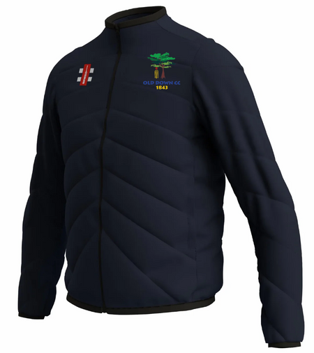 The Gray Nicolls Old Down CC GTS Full Zip Jacket is a navy padded jacket with the Old Idavine CC 1843 logo on the chest and a red and white emblem on the other side.