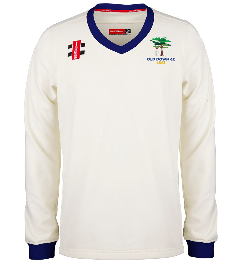 The Gray Nicolls Old Down CC Pro Performance L/S Sweater is a white long-sleeve top with blue collar and cuffs, featuring a tree and OLD DOWN CC 1845 club logo on the left chest plus manufacturer logos on the right chest and shoulder.