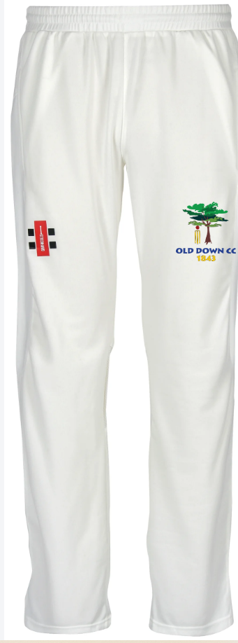 The Gray Nicolls Old Down CC Velocity III Match Trouser features an elastic waistband, a club logo patch on the left thigh, and an embroidered tree logo with ‘OLD DOWN CC 1949’ on the right thigh.