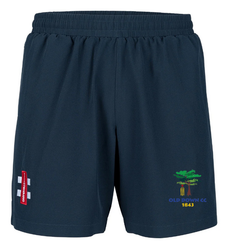 Old Down CC Velocity Shorts by Gray Nicolls—navy blue with elastic waistband, red and white logo on the left thigh, green tree Old Down CC 1843 emblem on the right. Four-way stretch fabric delivers maximum comfort for training.