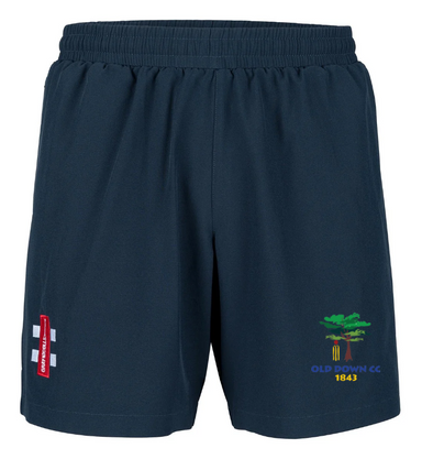Old Down CC Velocity Shorts by Gray Nicolls—navy blue with elastic waistband, red and white logo on the left thigh, green tree Old Down CC 1843 emblem on the right. Four-way stretch fabric delivers maximum comfort for training.