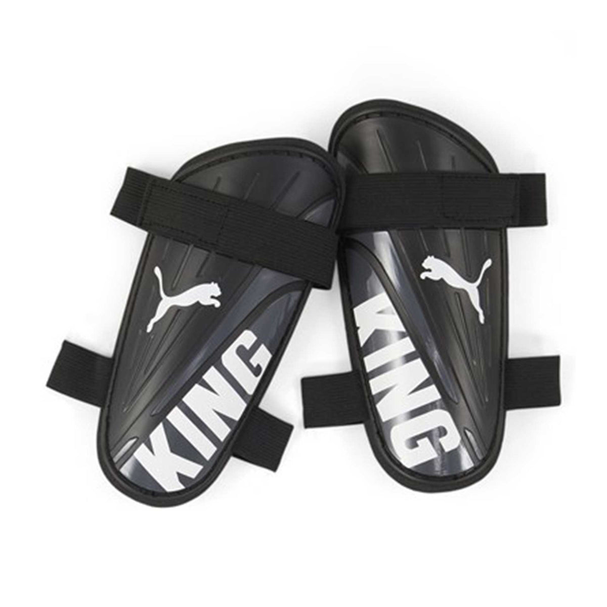 The Puma King Strap Shin Guard by Puma offers premium protection for soccer players, featuring "KING" in white and white Puma logos on black guards secured with black elastic straps.