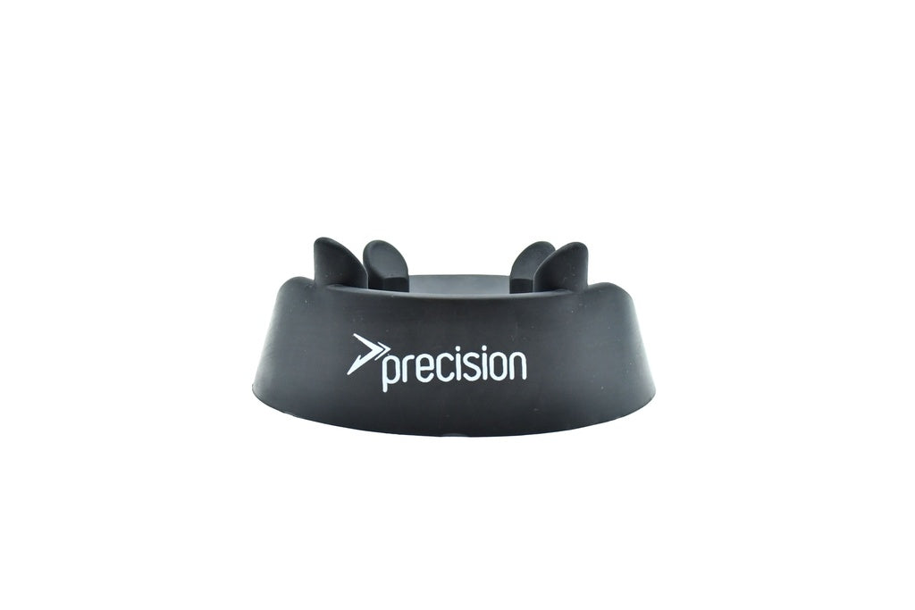 The Precision Training Rugby Kicking Tee features a black moulded rubber design with curved, raised sections for optimal kicking accuracy. "Precision" and the logo are printed in white on the front against a plain white background.