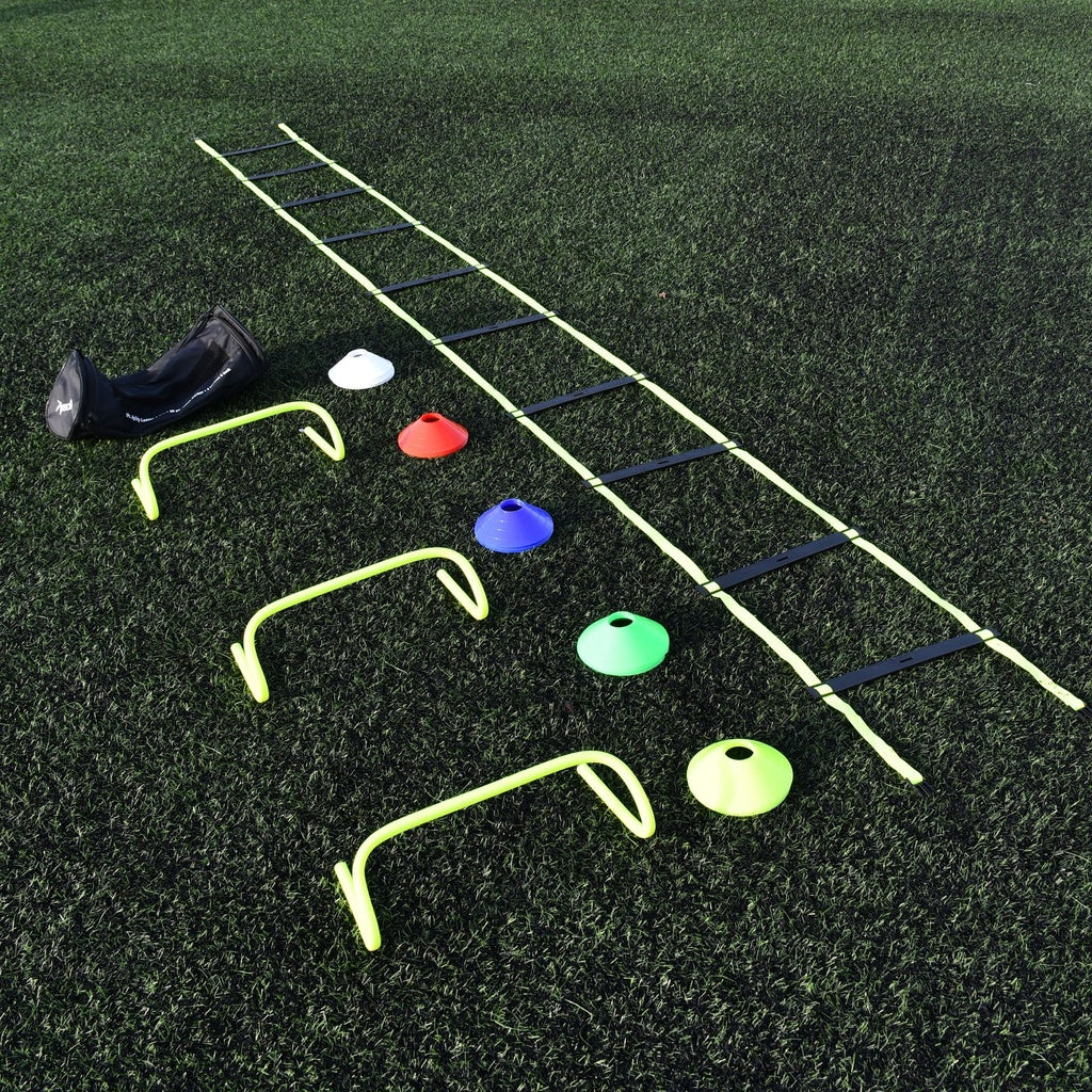 The Precision Coach Training Set by Precision Training includes a black bag, white cone, three yellow mini hurdles, multicolored cones, and an agility ladder—perfect for speed training and agility drills on artificial turf.