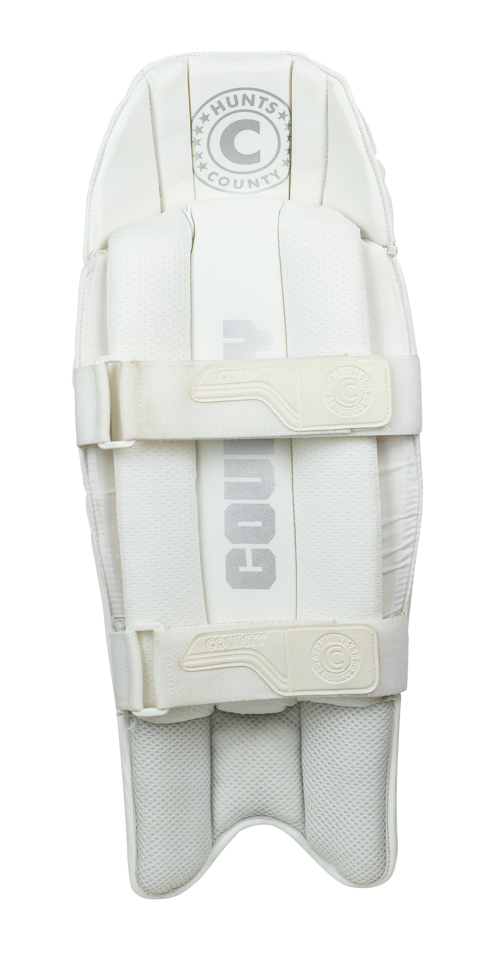 The Hunts County Platinum Wicket Keeping Pads are lightweight, test-level white pads with "Hunts County" in gray, two padded straps, and a textured protective surface, shown on a white background.