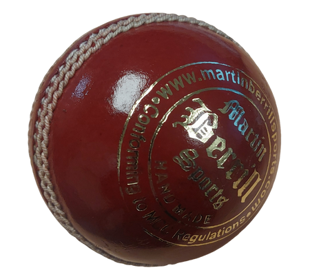 A close-up of the MBS Platinum Crown Cricket Ball by Martin Berrill Sports, crafted from English Alum Tanned Leather, featuring hand stitching and gold-embossed branding.