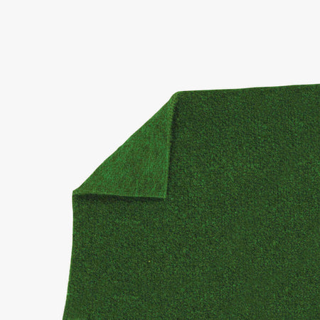 The ActionPitch Cricket Matting (Glue Down) by Martin Berrill Sports is a green rectangular artificial turf, designed specifically for cricket with one corner folded upward to showcase its texture and thickness—perfect for glue down installation over concrete surfaces.