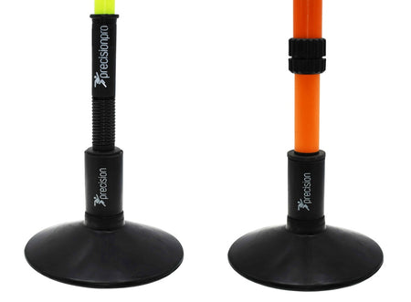 Two adjustable Precision Training poles with weighted rubber bases: the yellow pole has a spring and lock, the orange has a ring adjuster. Both use Precision Rubber Corner & Boundary Pole Bases, branded for Precision Training.