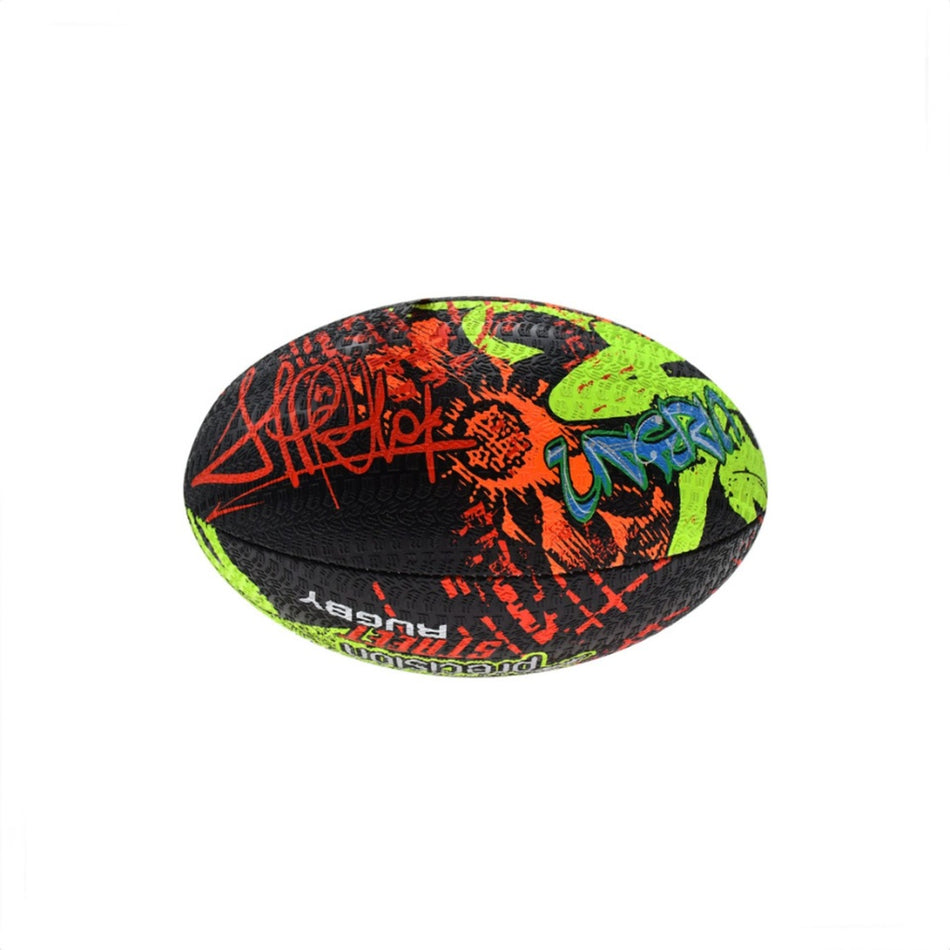 The Precision Street Mania Rugby Ball by Precision Training features bright red, green, and blue graffiti-style designs on black vulcanised rubber and is shown against a plain white background.